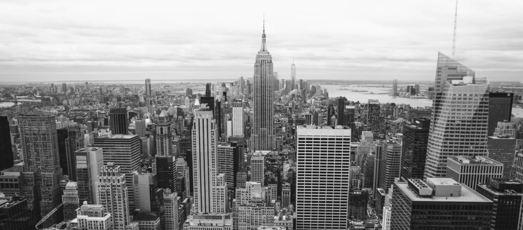 Classic black and white view of New York City's skyline featuring skyscrapers and urban architecture.